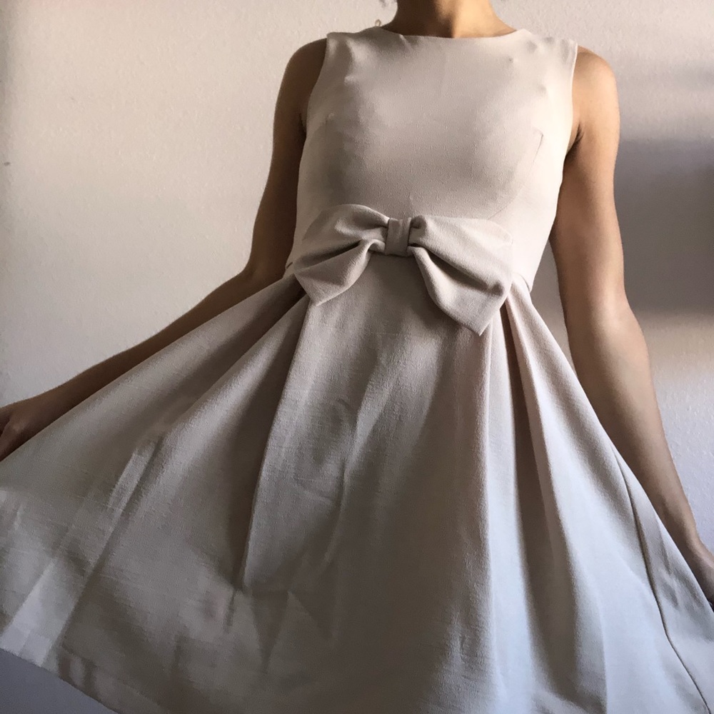 Beige dress with bow